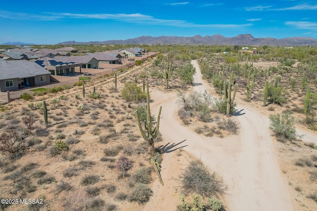 birds eye view of property with a residential view and a mountain view