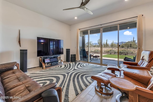 living area featuring recessed lighting, a ceiling fan, and wood finished floors