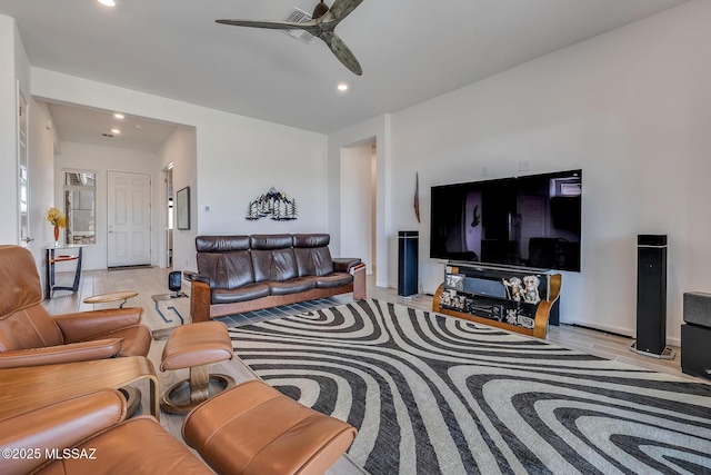 living room featuring recessed lighting and a ceiling fan