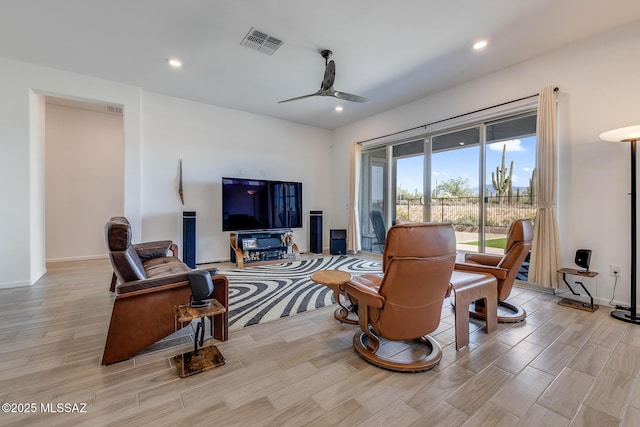 living area with wood finish floors, visible vents, recessed lighting, baseboards, and ceiling fan