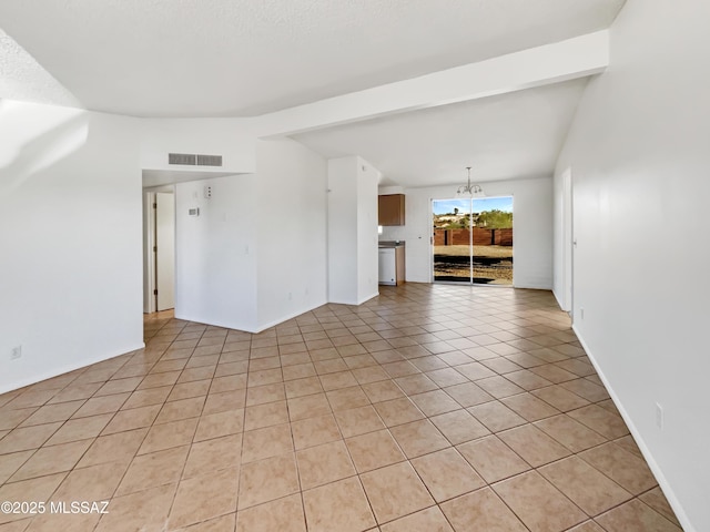 empty room with vaulted ceiling with beams, light tile patterned floors, visible vents, and an inviting chandelier