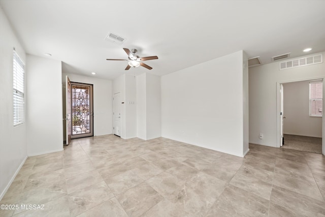 unfurnished room with visible vents, recessed lighting, and a ceiling fan