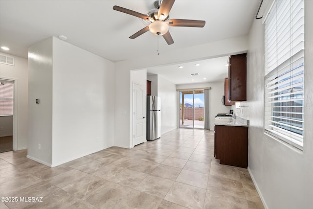 interior space featuring visible vents, recessed lighting, freestanding refrigerator, and ceiling fan