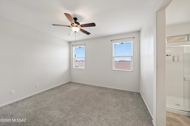 unfurnished room with baseboards, light colored carpet, and ceiling fan