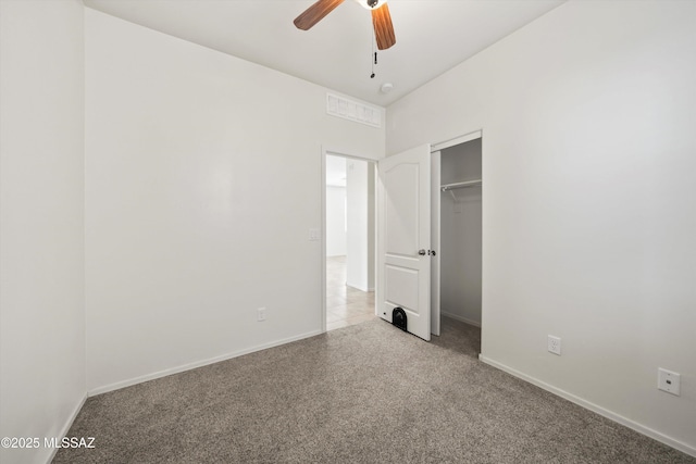 unfurnished bedroom featuring a closet, visible vents, baseboards, and carpet floors