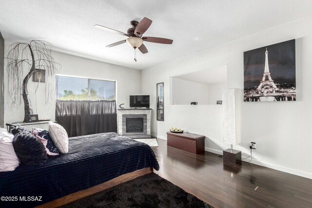 7071 E Corto Caravaca, Tucson, AZ 85715 - bedroom with wood finished floors, baseboards, and a ceiling fan