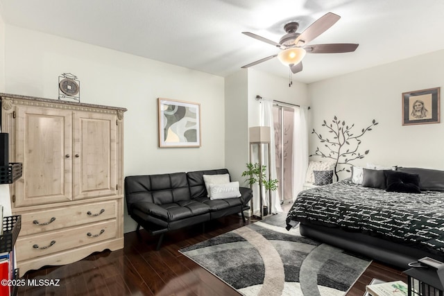 bedroom with dark wood-type flooring and a ceiling fan