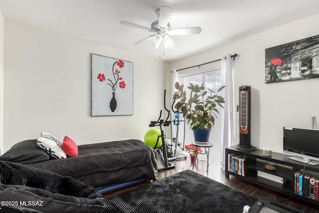 bedroom featuring ceiling fan and wood finished floors