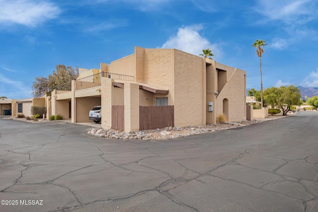 7071 E Corto Caravaca, Tucson, AZ 85715 - view of home's exterior with covered parking and stucco siding