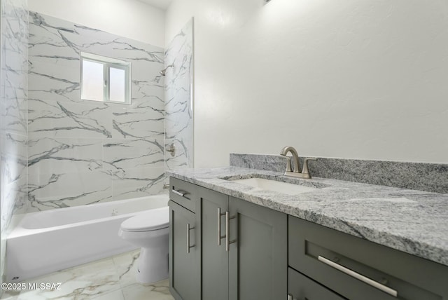 bathroom featuring toilet, marble finish floor,  shower combination, and vanity