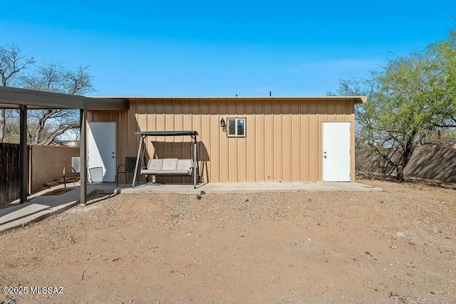 view of outdoor structure with fence