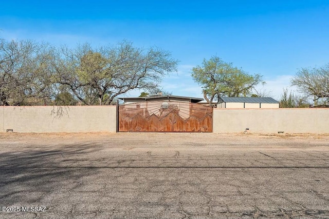 view of yard featuring a gate and a fenced front yard
