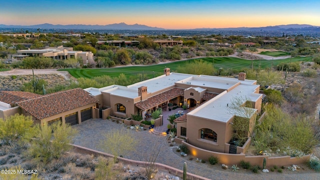 birds eye view of property featuring a mountain view