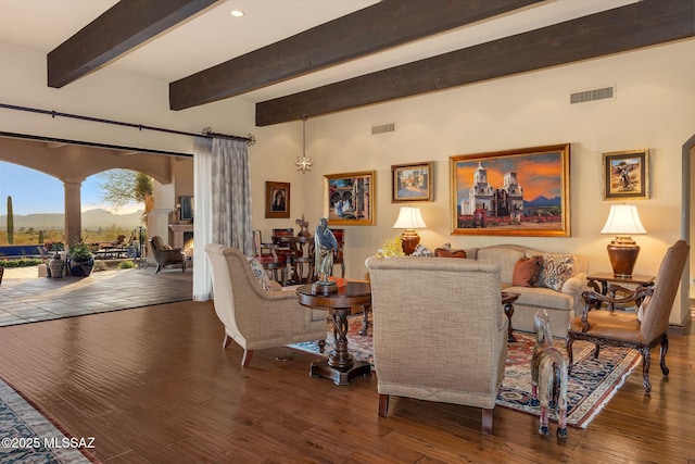 living room featuring recessed lighting, beam ceiling, visible vents, and hardwood / wood-style flooring