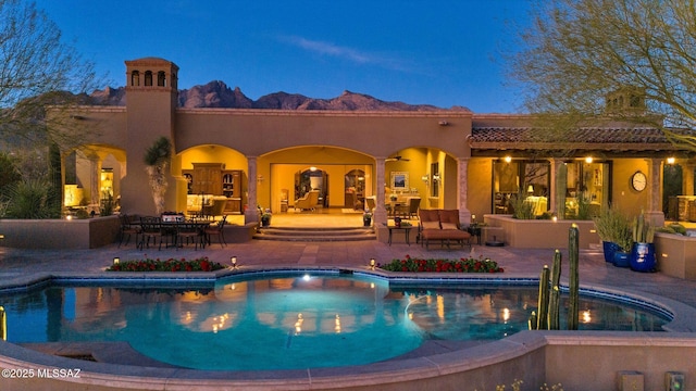 outdoor pool with a patio area