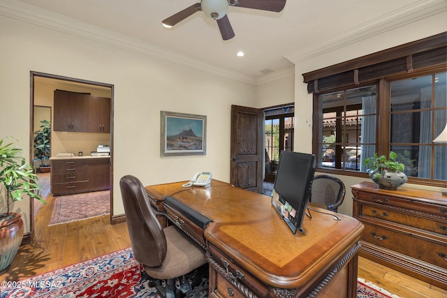 office space featuring hardwood / wood-style flooring, recessed lighting, a ceiling fan, baseboards, and crown molding