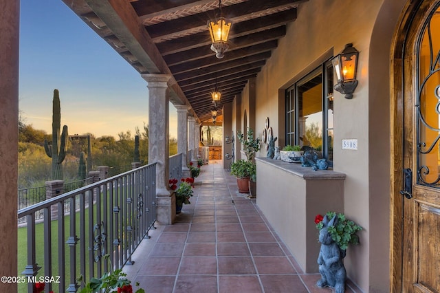 view of balcony at dusk