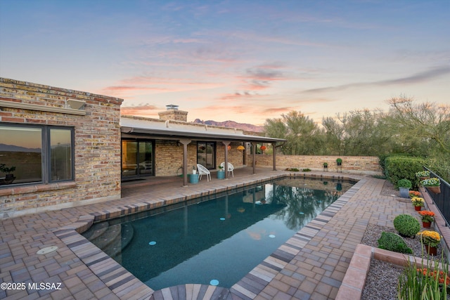 view of pool featuring a fenced in pool and a patio area