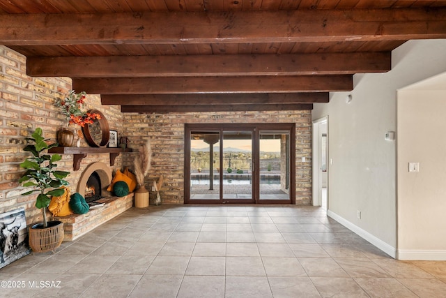 unfurnished living room featuring wooden ceiling, a fireplace, beamed ceiling, and light tile patterned floors