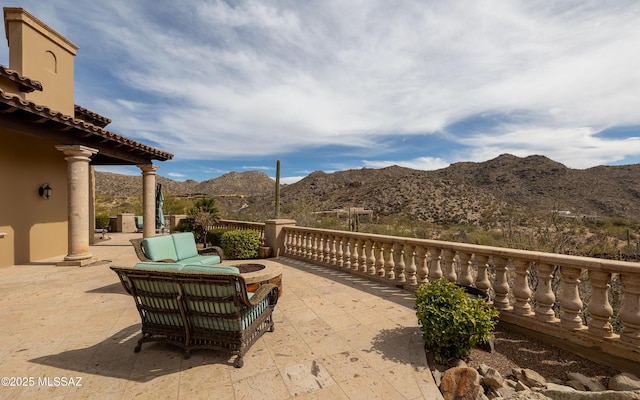 view of patio / terrace featuring a mountain view