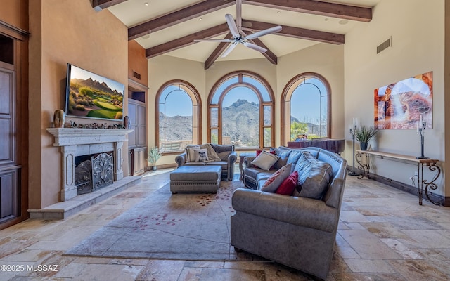 view of patio with visible vents, a ceiling fan, and an outdoor living space with a fireplace