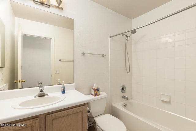 bathroom featuring shower / washtub combination, vanity, and toilet