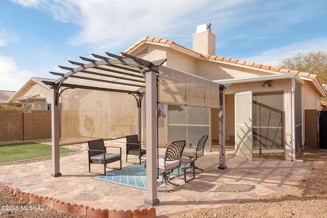 view of patio featuring fence and a pergola