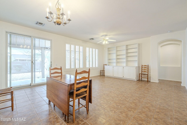 dining area featuring ceiling fan with notable chandelier, visible vents, baseboards, and light tile patterned flooring