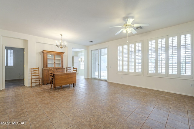 unfurnished living room featuring ceiling fan with notable chandelier, visible vents, and tile patterned floors