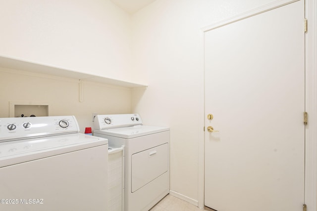 laundry area featuring laundry area and washer and clothes dryer