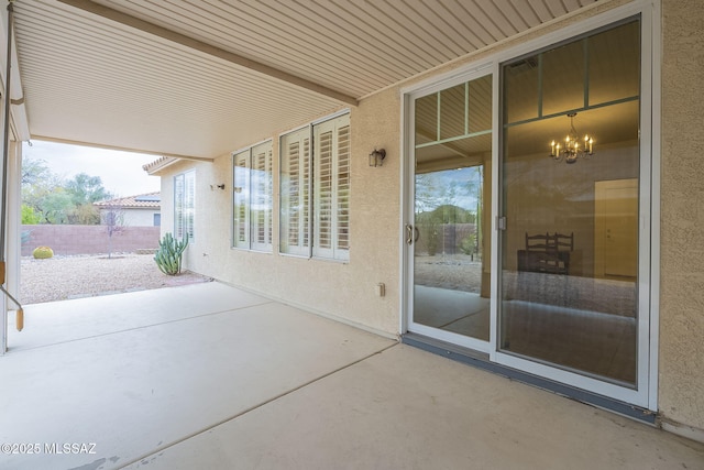 view of patio featuring fence