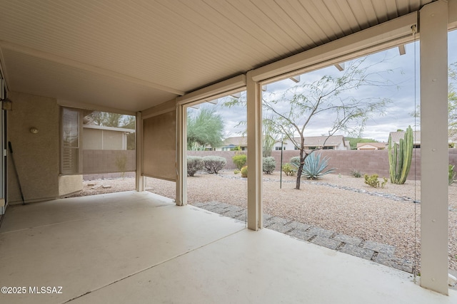 view of patio featuring fence