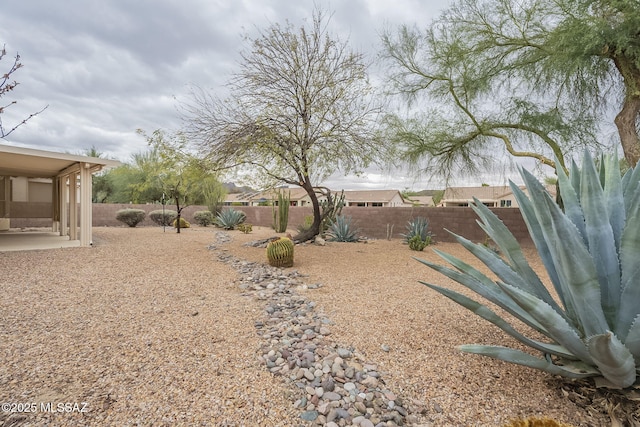 view of yard featuring a fenced backyard and a patio