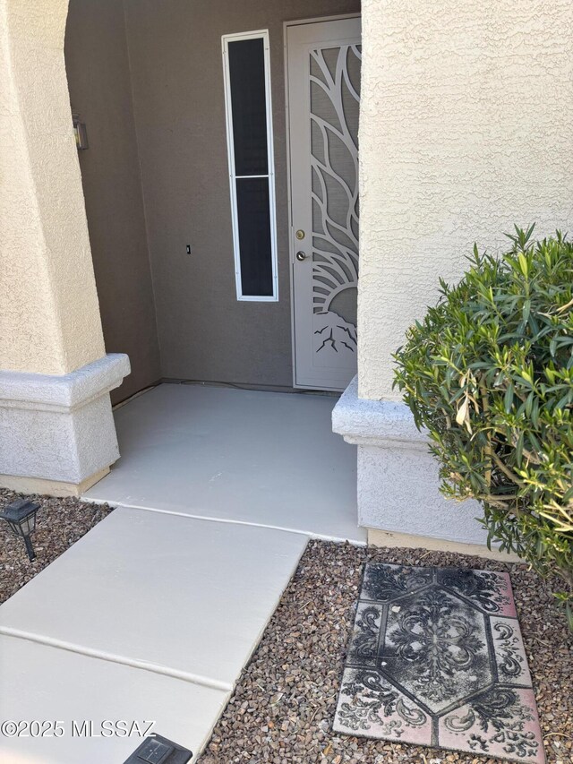 9373 N Sombrero Canyon Dr, Tucson, AZ 85743 - doorway to property featuring stucco siding