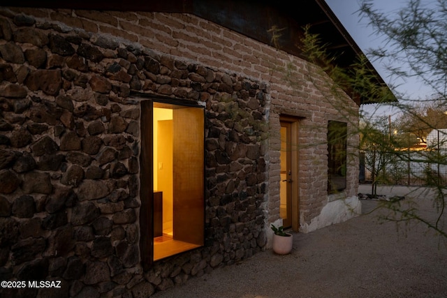 view of home's exterior with stone siding
