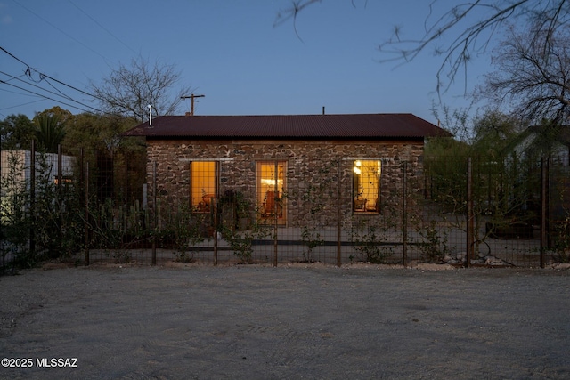 view of side of property featuring fence