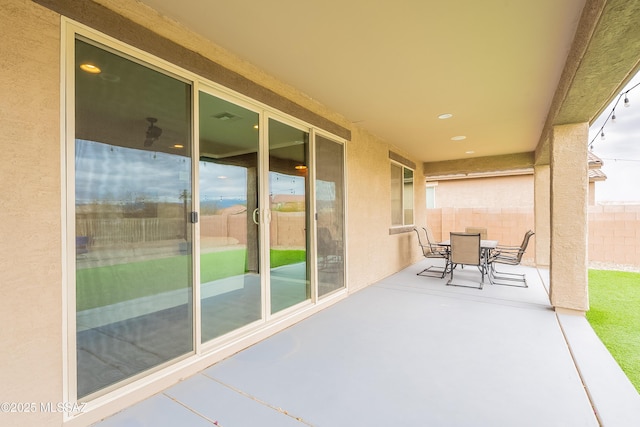 view of patio / terrace with outdoor dining area and fence