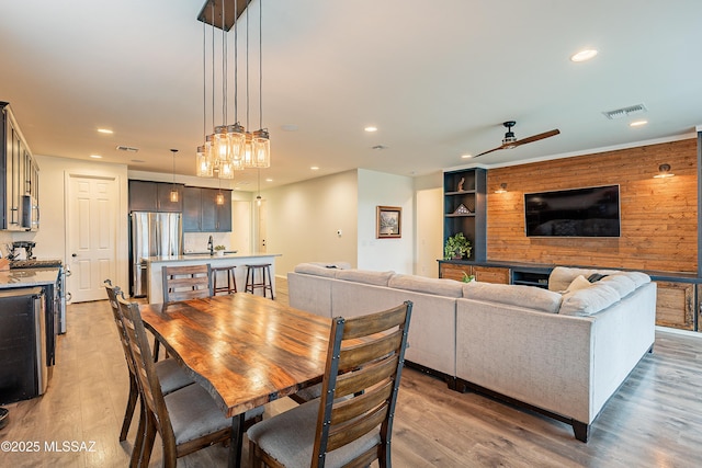 dining space with recessed lighting, visible vents, and light wood-style floors