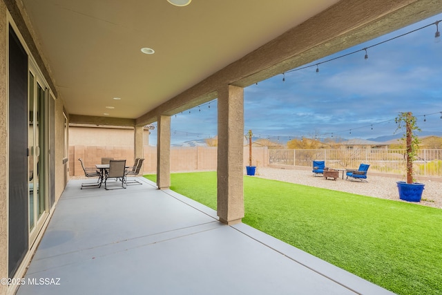 view of patio / terrace featuring outdoor dining area and a fenced backyard