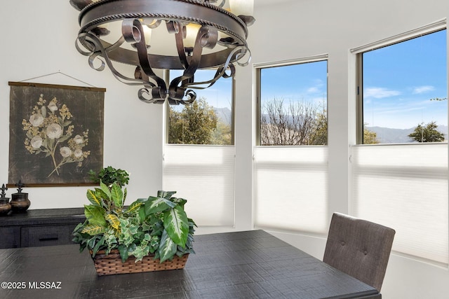 dining space featuring a notable chandelier