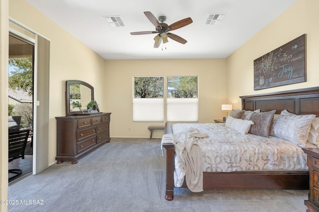 bedroom with visible vents, multiple windows, and access to exterior