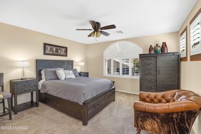 bedroom with a ceiling fan, light colored carpet, visible vents, and baseboards