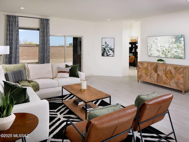 living room with recessed lighting and wood finished floors