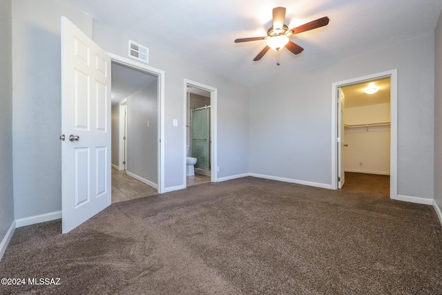 2608 E Warwick Vis, Tucson, AZ 85713 - unfurnished bedroom with carpet, a spacious closet, baseboards, and ensuite bathroom