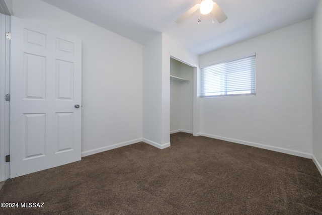 2608 E Warwick Vis, Tucson, AZ 85713 - unfurnished bedroom with dark colored carpet, baseboards, a closet, and a ceiling fan