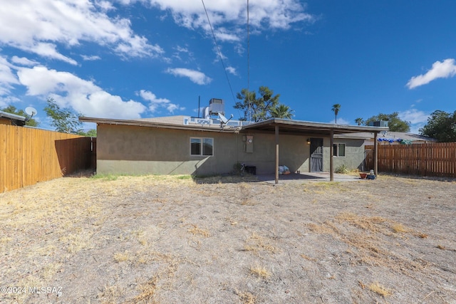 2608 E Warwick Vis, Tucson, AZ 85713 - rear view of property featuring a fenced backyard, stucco siding, and a patio