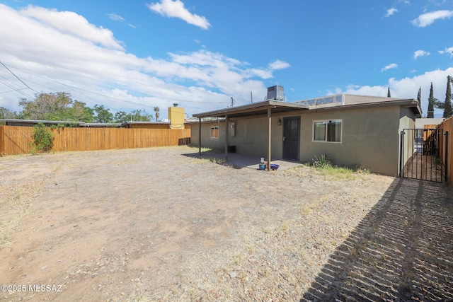 2608 E Warwick Vis, Tucson, AZ 85713 - rear view of property with stucco siding, a gate, and a patio