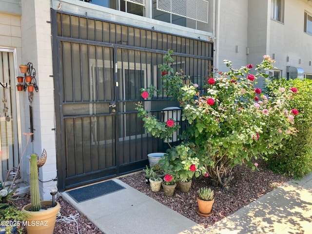 doorway to property with concrete block siding