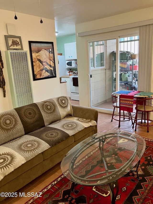 living room with a healthy amount of sunlight and tile patterned flooring