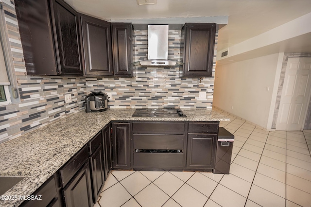 2724 N Green Pl, Nogales, AZ 85621 - kitchen featuring light tile patterned floors, visible vents, black electric stovetop, wall chimney range hood, and backsplash